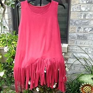 Red asymetrically fringed bottom faux suede top.